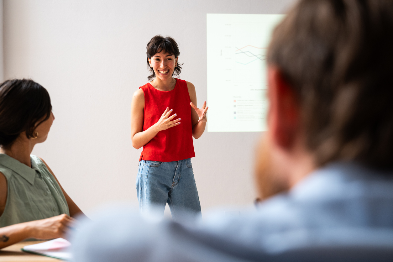 Young woman making a presentation in the meeting room